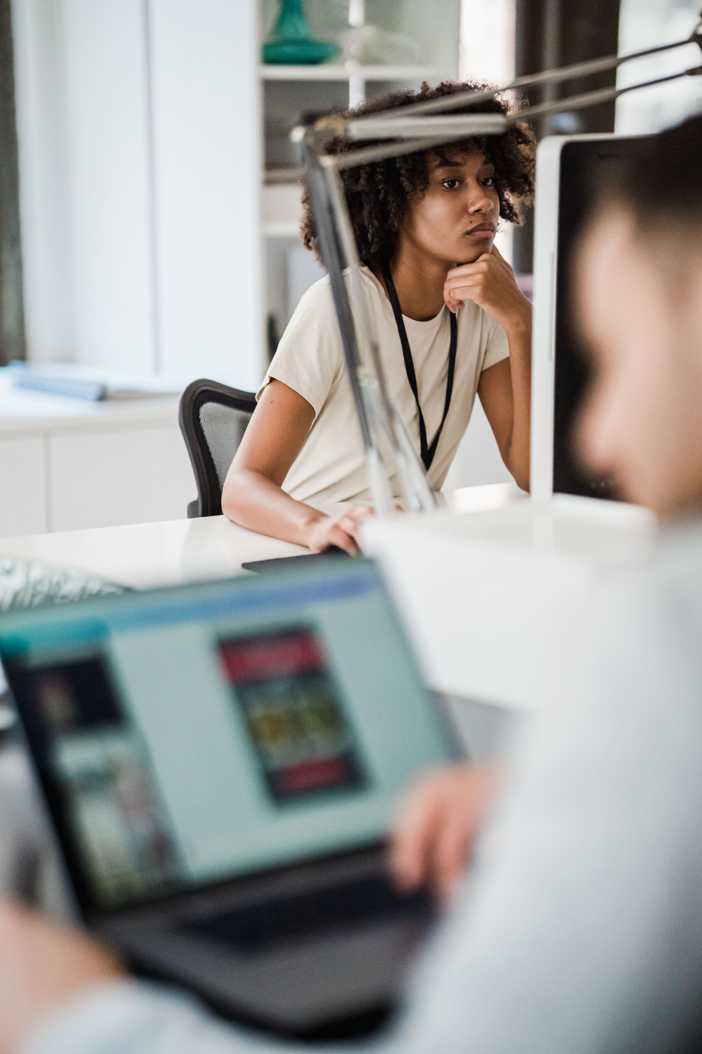 An employee at her desk, present but distant