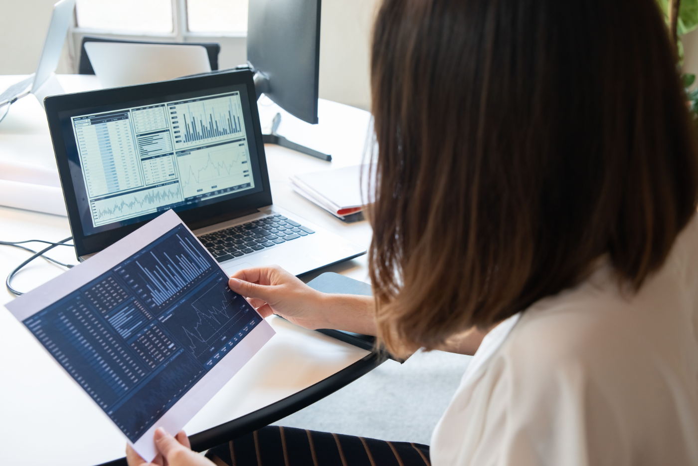 An HR lead reviewing wellbeing dashboards and reports